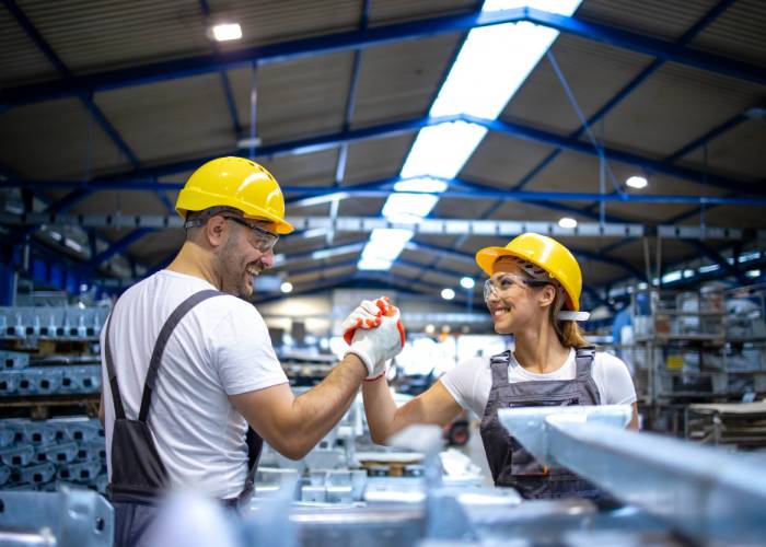 factory-workers-handshaking-each-other-production-line